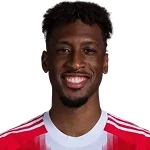 K. Coman